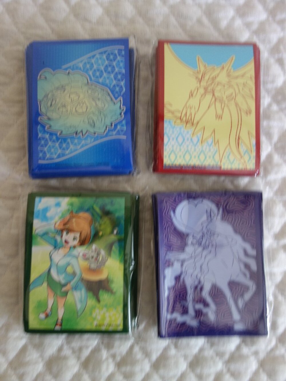 (f)	Lot of 4 NIP 65 count ea POKEMAN Trading Card Sleeves
